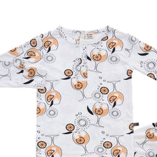 Load image into Gallery viewer, A white two-piece toddler sleepwear set with long sleeves, featuring a pattern inspired by the Aperol Spritz cocktail with orange and floral motifs.
