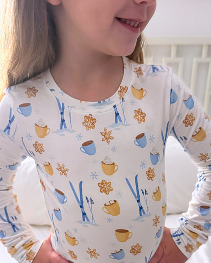 Child wearing a long-sleeve shirt with winter-themed pattern