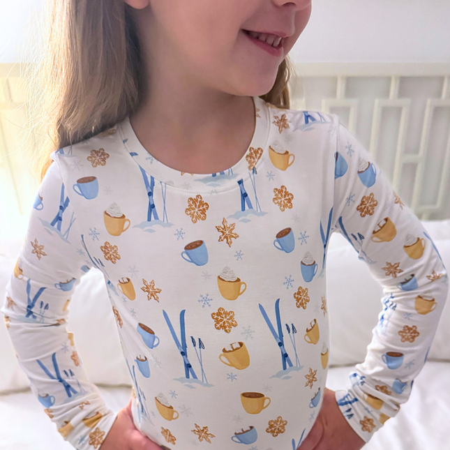 Child wearing a long-sleeve shirt with winter-themed pattern