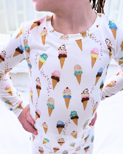 Person wearing a long-sleeve shirt with ice cream cone pattern
