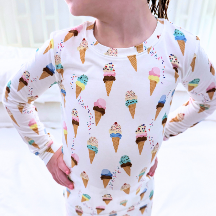 Person wearing a long-sleeve shirt with ice cream cone pattern