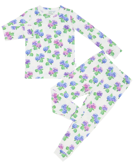 A two-piece pajama set for toddlers with a hydrangea flower pattern in purple, pink, and blue colors on a white background, including a long-sleeve top and matching pants.