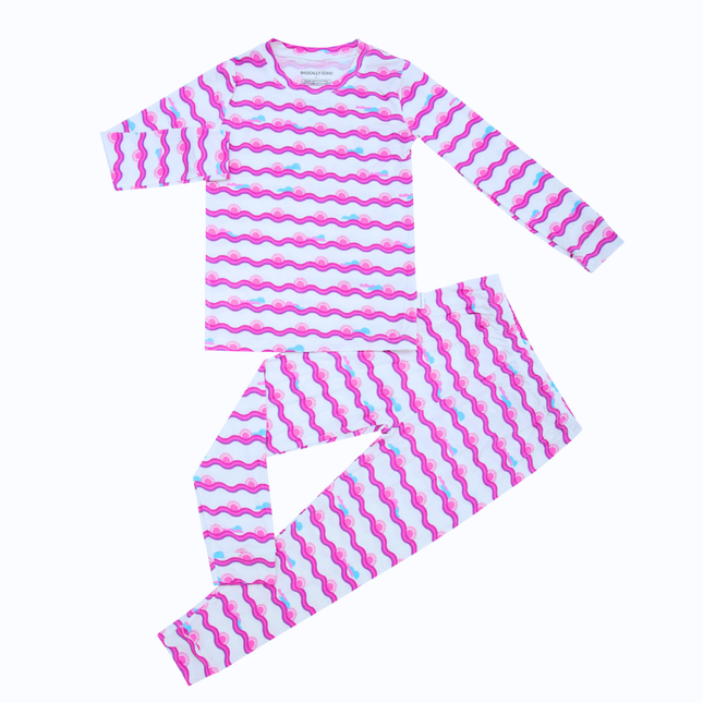 Pink and white striped pajama set on a white background